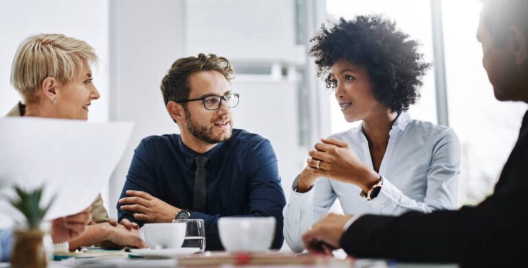 Shot of a group of businesspeople sitting together in a meeting