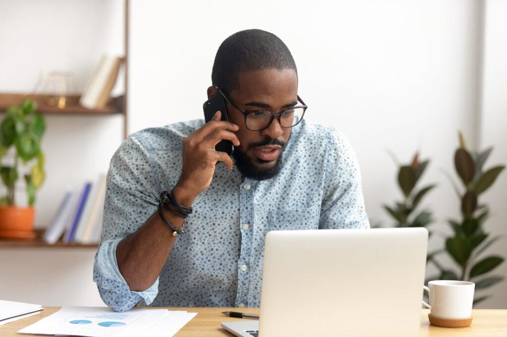 Man on the phone with laptop