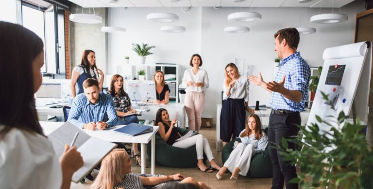 Business man makes a presentation in the office standing behind