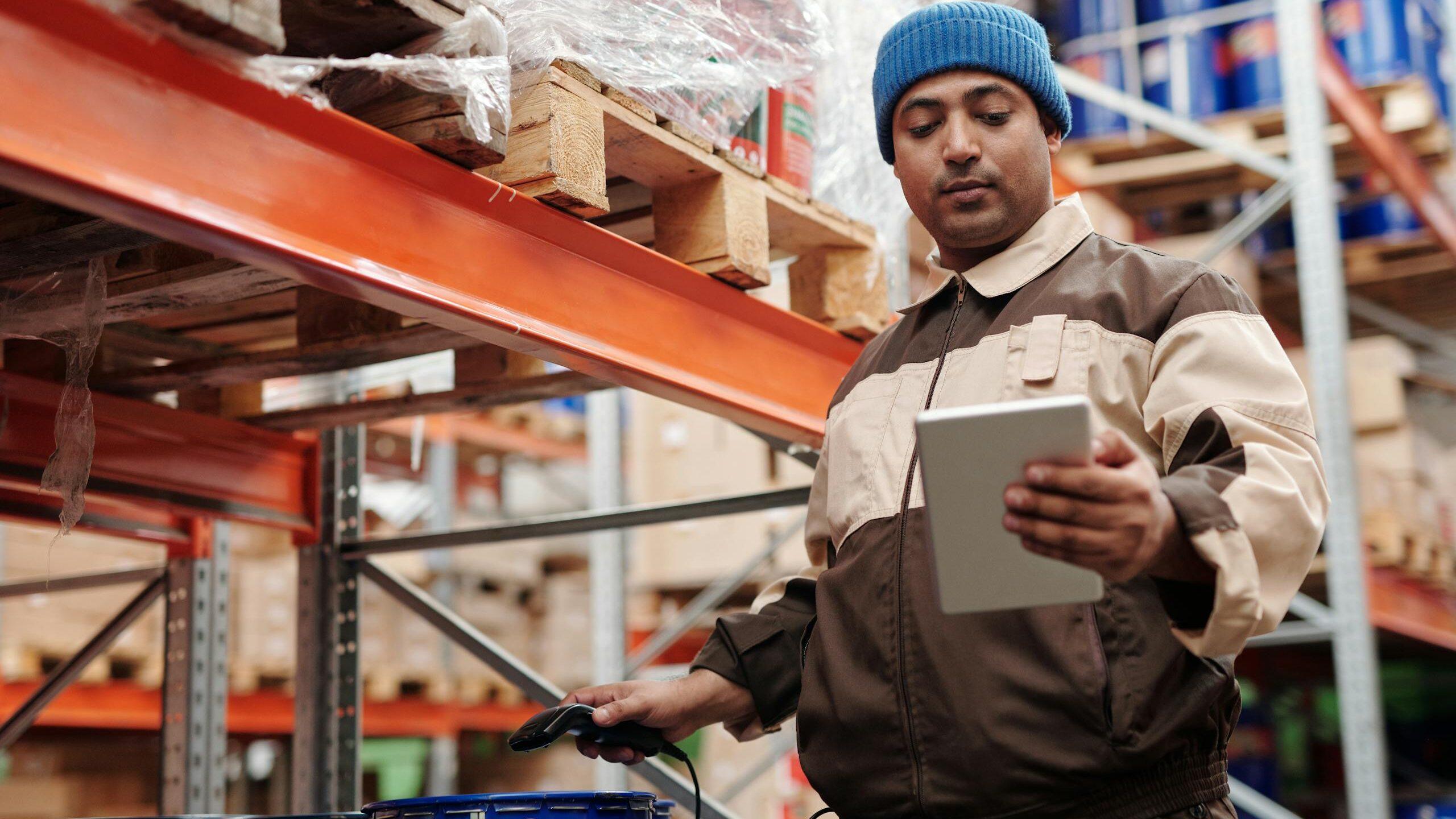 Man Holding Digital Tablet