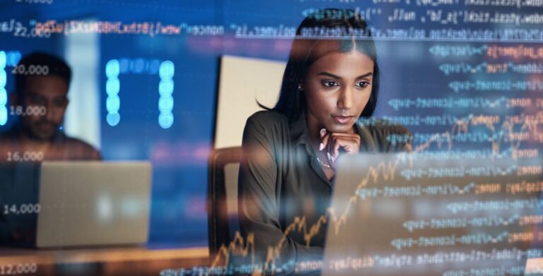 female IT worker focused on a laptop screen