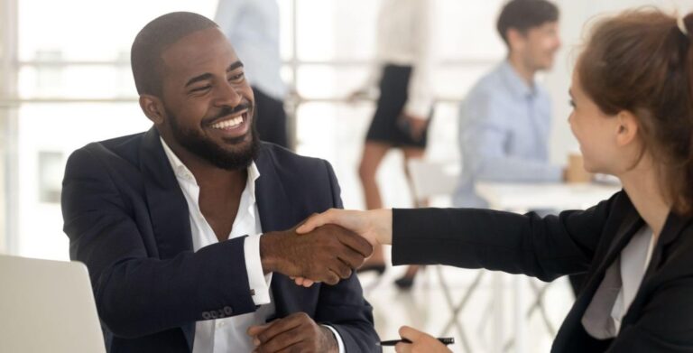 interviewer and interviewee shaking hands