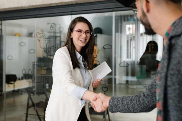 interviewer from a IT staffing agency shaking hands with interviewee