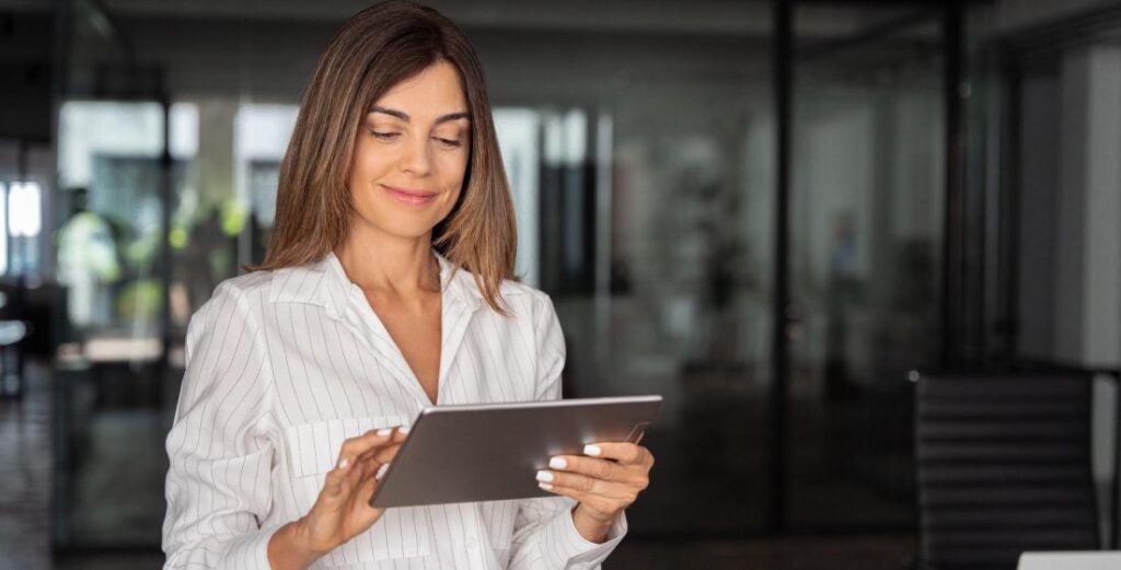 professional woman analyzing finance data on a tablet