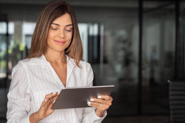 professional woman analyzing finance data on a tablet