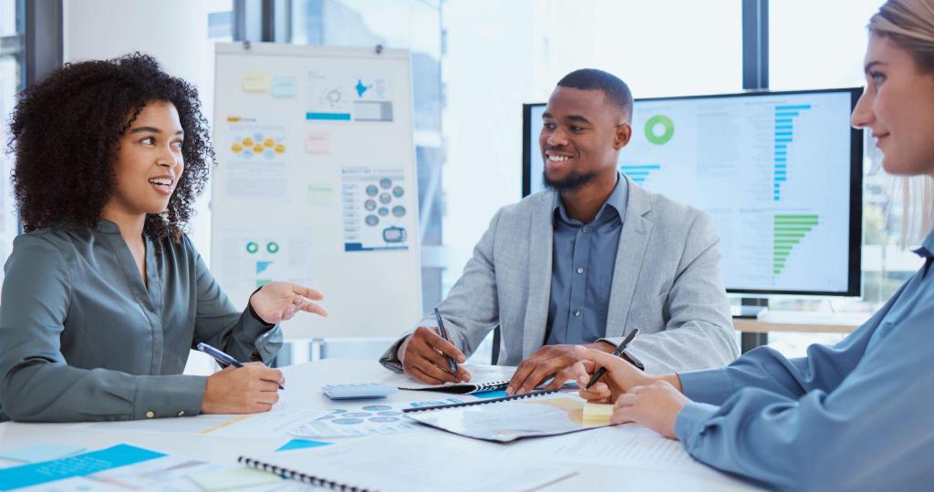 three finance experts in a meeting room discussing a partnership with a major regional bank