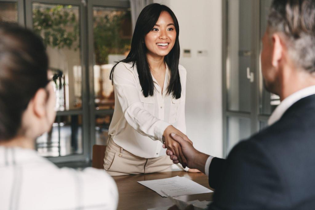 woman shaking hand of her interviewer at a job interview