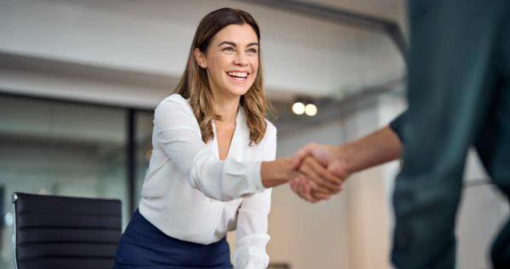 woman shaking hands with interviewer