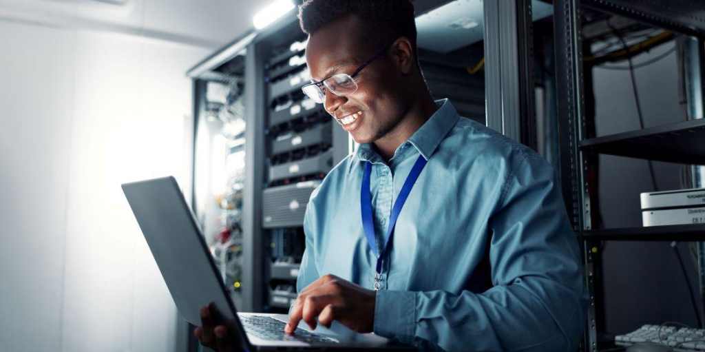 young black employee with a laptop at work