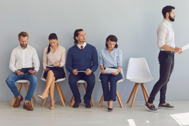 Job candidates waiting in line for interviews