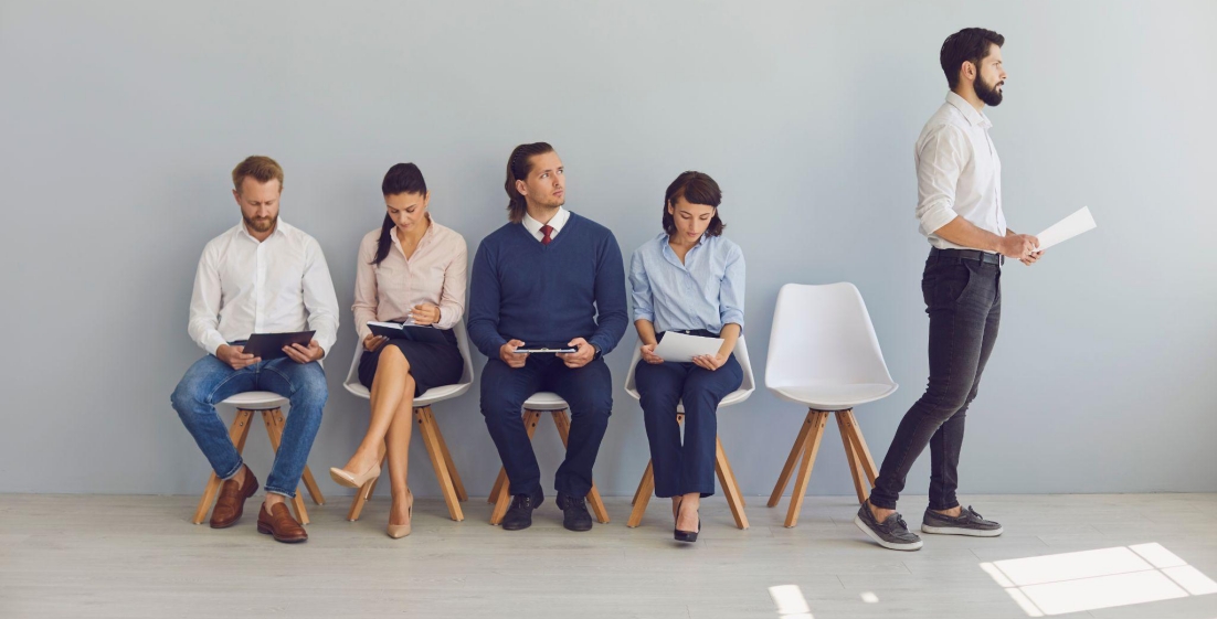 Job candidates waiting in line for interviews