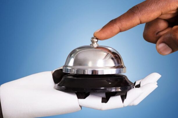 person ringing a bell held by a robot hand