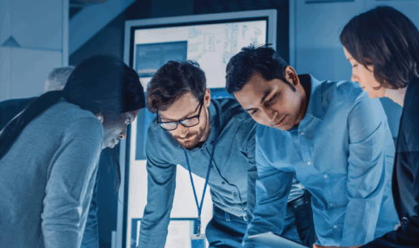 Diverse team collaborating on a project in a high-tech office environment