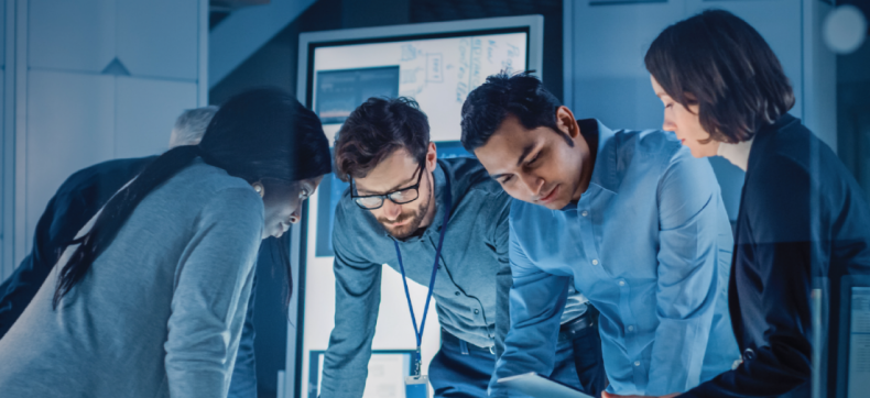 Diverse team collaborating on a project in a high-tech office environment