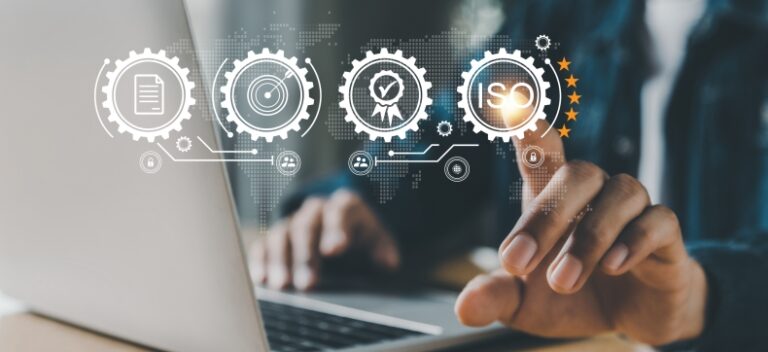 Person interacting with virtual ISO certification icons on laptop screen