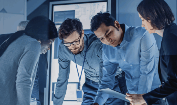 Diverse professionals collaborating over document in modern office