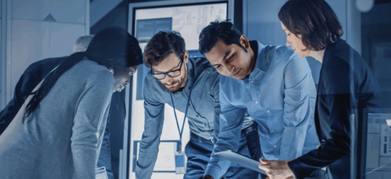 Diverse professionals collaborating over document in modern office