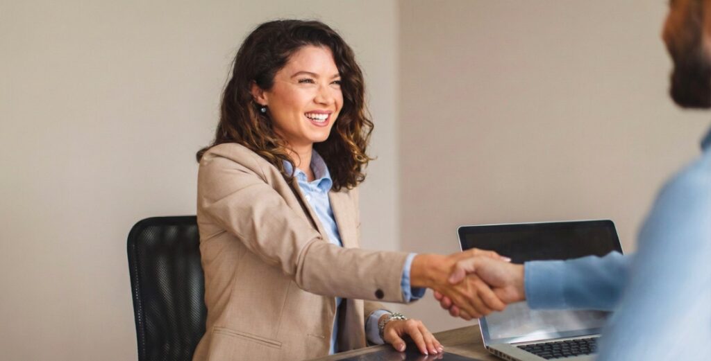 Professional businesswoman shaking hands in job interview