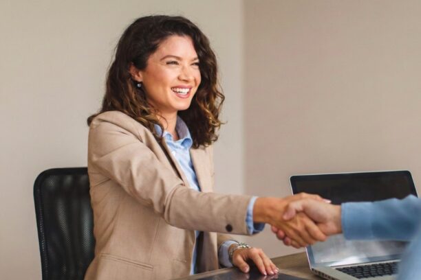 Professional businesswoman shaking hands in job interview